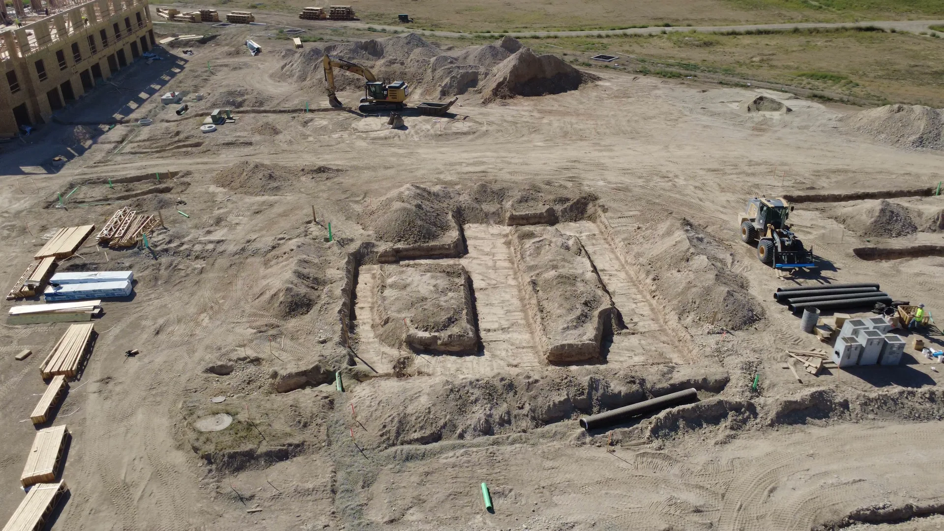 The Arête amenity clubhouse site in September 2026 as footings begin — formwork and excavation for the first foundations of the building